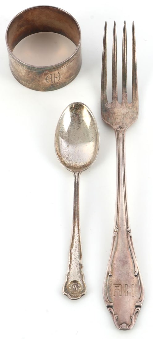 3 WWII GERMAN REICH ADOLF HILTER & SS DINNERWARE: Lot of three (3) WWII German Reich dinnerware items including an Adolf Hitler Fork, Adolf Hitler Napkin ring, and lastly an SS teaspoon. Both fork and ring feature the initials "AH" with the fork's re