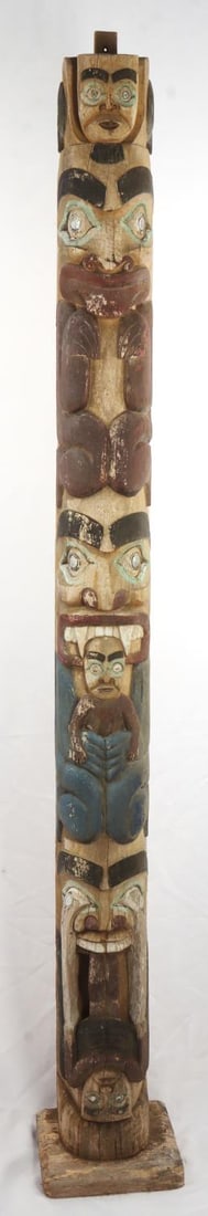 NORTHWEST NATIVE AMERICAN TOTEM POLE: Native American totem pole. Likely carved by members of the Coastal Salish or Alaskan tribe, but emulating imagery and style used by various Northwestern Native American tribes. Mother of pearl is use