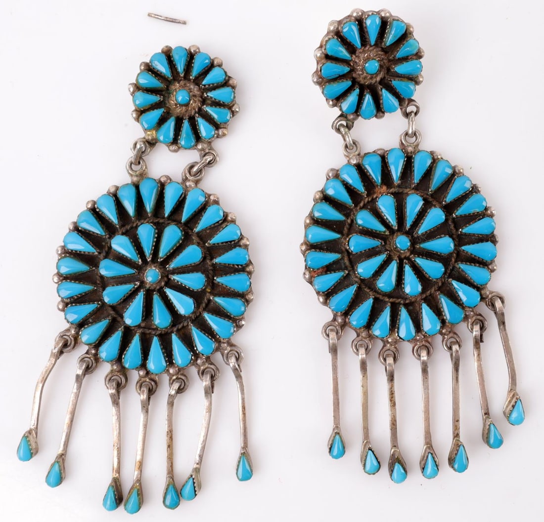 ZUNI TURQUOISE & SILVER CLUSTER EARRINGS: Large Zuni-style cluster earrings with dark blue turquoise stones. Initial cluster is in two rings and 1.75 inches in diameter. Smaller cluster is a single ring and 1-inch in diameter. One of the ear