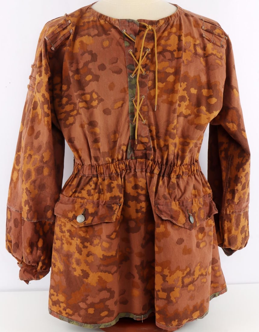 WWII GERMAN REICH WAFFEN SS M1940 CAMO SMOCK: Waffen SS M1940 reversible camouflage smock. Features planetree spring and autumn patterns, foliage loops, and two (2) front pockets with pebbled buttons. Does not fluoresce under UV. No mothing prese