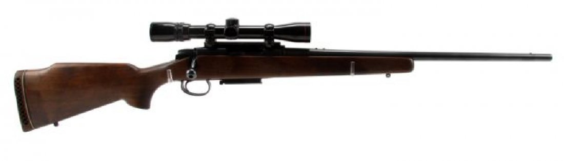 REMINGTON MODEL 788 SPORTING RIFLE IN 30-30 WIN: Remington Model 788 bolt action sporting rifle, chambered in .30-30 Win, with Simmons Model 21010 waterproof 9x scope. Bore is bright and clean, bluing is 98%, and stock is very good, with minor handl