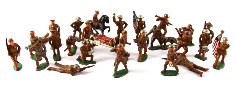 LARGE GROUPING OF MIXED TOY SOLDIERS BARCLAY MORE: Includes total of twenty six toy soldiers (Barclay, Manoil, and more). Some rare pieces. Overall in fair to good condition, three missing helmet.