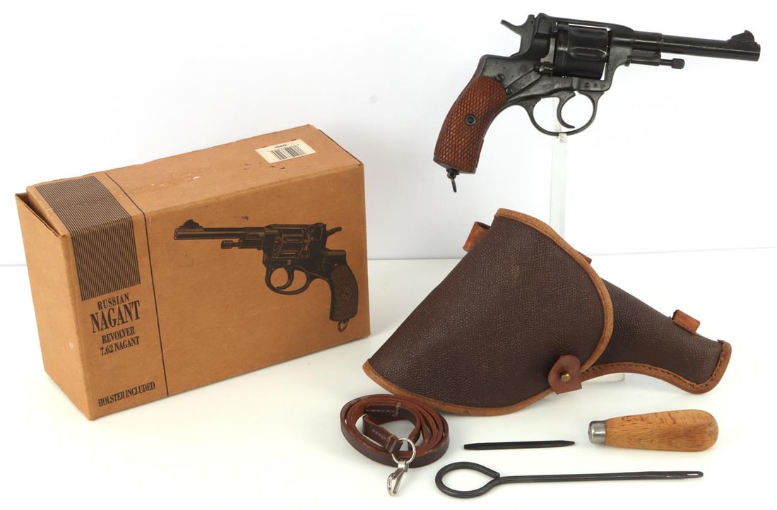 1895 RUSSIAN NAGANT 1902 IMPERIAL TULA FACTORY MFG: 1895 Russian Nagant Revolver, holster, cleaning rod, lanyard sling, cleaning pick, and 1990s import box. The specifics for the revolver are that it was made in 1902 at the Imperial Tula factory for th