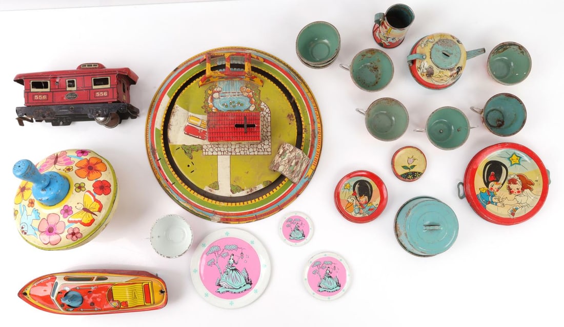 VINTAGE TIN LITHO OHIO ART CO TOY LOT OF 35: Lot of thirty-five (35) pieces. Vintage Ohio Art Co litho tin toy tea set (31 pieces). Spinning top, boat, train car and train model. Group in fair condition.