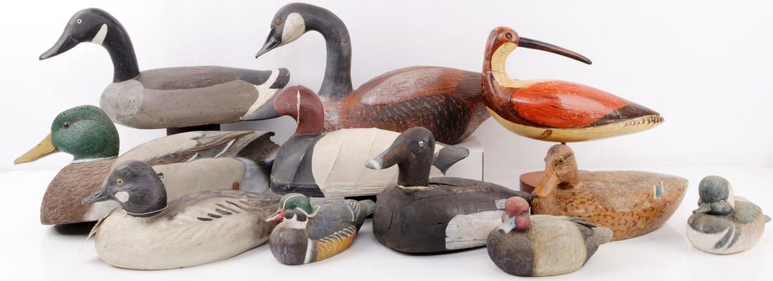 LOT OF 11 DECOY AND DECORATIVE DUCKS WOOD CORK: Lot of 11 decoy and decorative ducks. 1 cork, 4 wood (1 with repaired head), 1 canvas with wood head (repaired), 4 decorative plaster (1 with a missing chipped tail), 1 wood decorative marsh bird on a