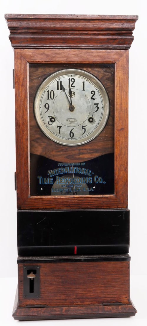 INTERNATIONAL TIME RECORDING CO WOODEN WALL CLOCK: Runs and holds time. Punch function works. It measures 31 3/8 X 13 3/4 X 8 3/4 inches.
