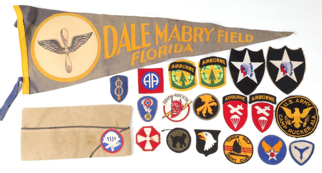 WWII PATCH & PENNANT LOT AIRBORNE GLIDER: Includes a Dale Mabry field pennant, Airborne glider side cap, and WWII patches, including Airborne and others.