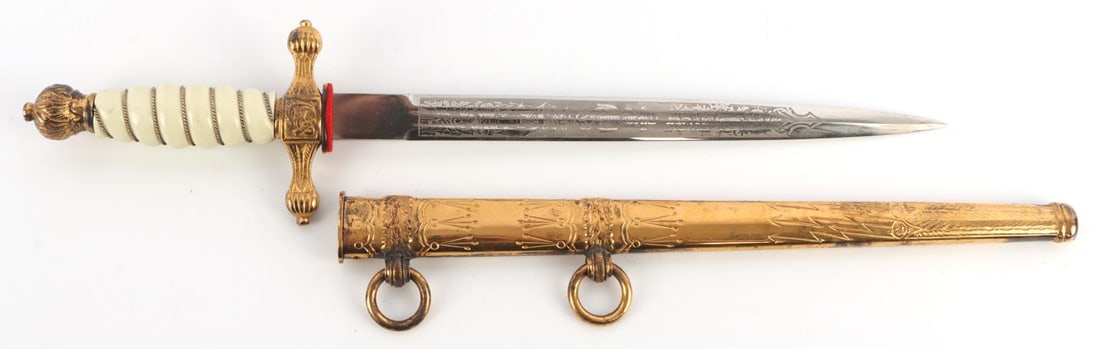 WWII GERMAN THIRD REICH KRIEGSMARINE DAGGER: Etched blade by E.F. Horster. Bakelite grip. Scabbard does not lock in place. Very good condition overall. Measures 15 3/4 inches overall. Unauthenticated, sold as is. This lot has a reserve.