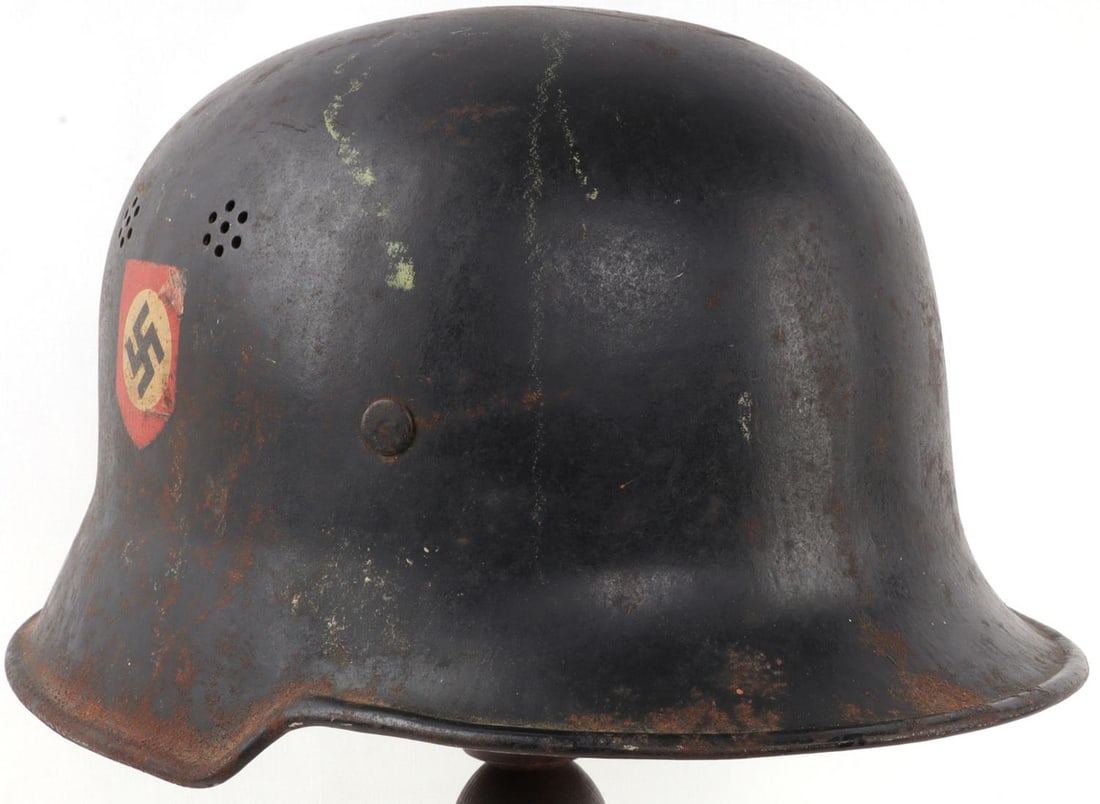 WWII GERMAN M34 DOUBLE DECAL POLICE FIRE HELMET: Ordnungspolizei M34 helmet with intact liner and neck cover tabs. The skirt of the helmet has a smooth rolled edge all the way around. The interior is stamped "D.R.P. Thale" next to a capital "A." The