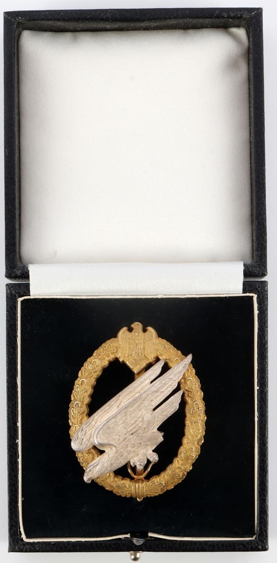 NAMED WWII GERMAN LUFTWAFFE PARATROOPER BADGE: Obverse features a Luftwaffe eagle diving riveted to an oak and laurel leaf wreath. Eagle marked with 800 for silver. Wreath is marked "Fallschirm Inf Btl. Obj Rummler. Still features factory frosting