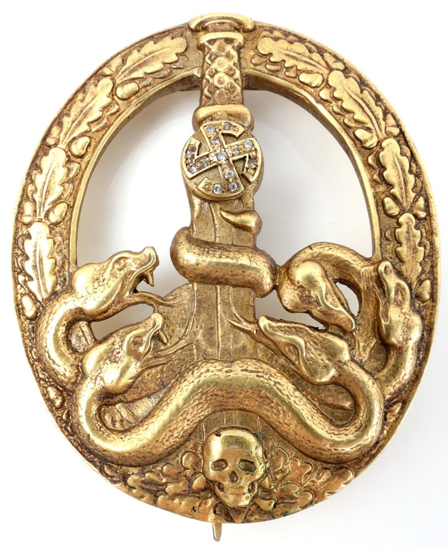 WWII GERMAN ANTIPARTISAN BADGE GOLD AND DIAMONDS: 800 silver acid tested badge with gold finish. Diamonds are too small to be tested, but appear to be rough cut. Hand-engraved C.E. Juncker and marked 800. Measures 2 1/4 inches. Very good condition. M