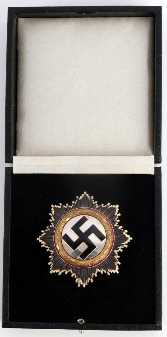 WWII THIRD REICH GERMAN CROSS IN GOLD OTTO KLEIN: Multi-piece construction. Black enamel swastika atop starburst pattern. 2.5 inches. Proof-like finish. Very good condition. Includes case. This lot has a reserve.
