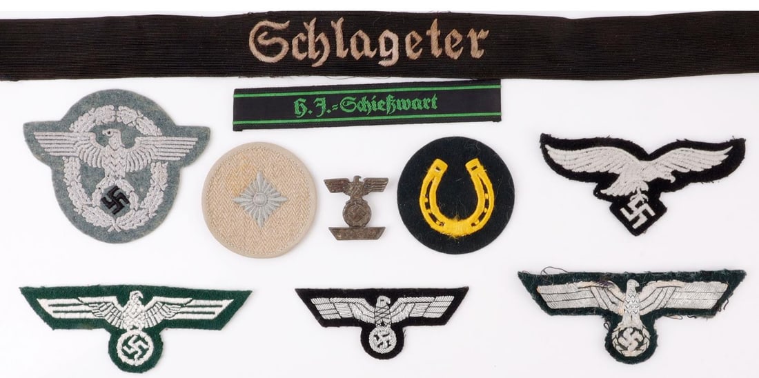 WWII GERMAN THIRD REICH PATCH & CUFF LOT OF 10: Lot of ten (10). 1) Schlageter Sturmabteilung cuff title. Silver metallic thread on black. RZM tag. Non-fluorescing. 22.2 X 1.1 inches.2) Reichsadler patch. Thick, raised metallic thread on black clot