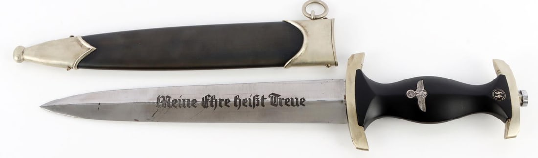 WWII GERMAN THIRD REICH SS HONOR DAGGER: Standard SS dagger with motto, nickel crossguard, ebony grip, and anodized scabbard. Measures 14 3/8 inches. High quality. Post-war assembled. This lot has a reserve.