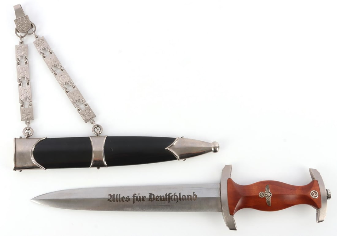 WWII GERMAN CHAINED NSKK SA HUHNLEIN DAGGER: Nickel crossguard and pommel with inlaid eagle and SA insignia. Acid etched. Obverse of blade reads Alles fur Deutschland." Reverse features Huhnlein signature with large SA and August Merten maker ma