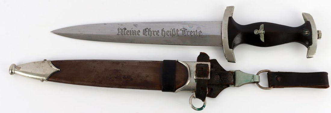 WWII SS HONOR DAGGER GROUND ROHM FROM JOHNSON: From LTC Tom Johnson. SS dagger with full ground Rohm inscription, nickel crossguards, ebonized wood grip, inlaid eagle and SS rune. Crossguard marked with "II" roman numerals and serialized 228229 wi