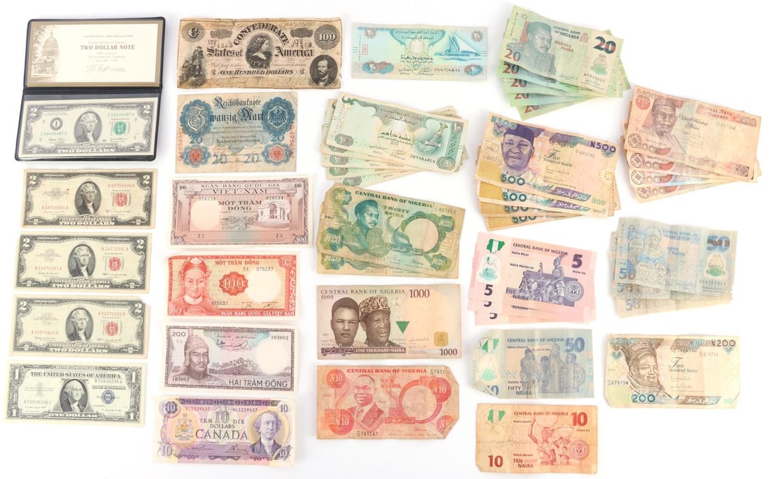 39 WORLD U.S. CONFEDERATE BANKNOTE LOT: Lot of thirty-nine (39). Includes a CSA $100 note although heavily circulated, uncirculated 1957 silver certificate, red seal $2.00 notes and a nice selection of circulated world notes.
