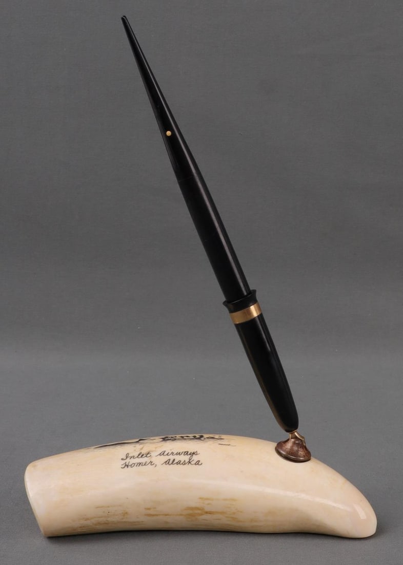 ANTIQUE IVORY PEN HOLDER W SHEAFFER'S 14K NIB PEN: Scrimshaw ivory pen holder and pen. 5.5 X 2 inches. Incised whale-hunting scene, signed "Nunuk" lower right. Pen not function tested or serviced. No international shipping. Know your state's laws prio