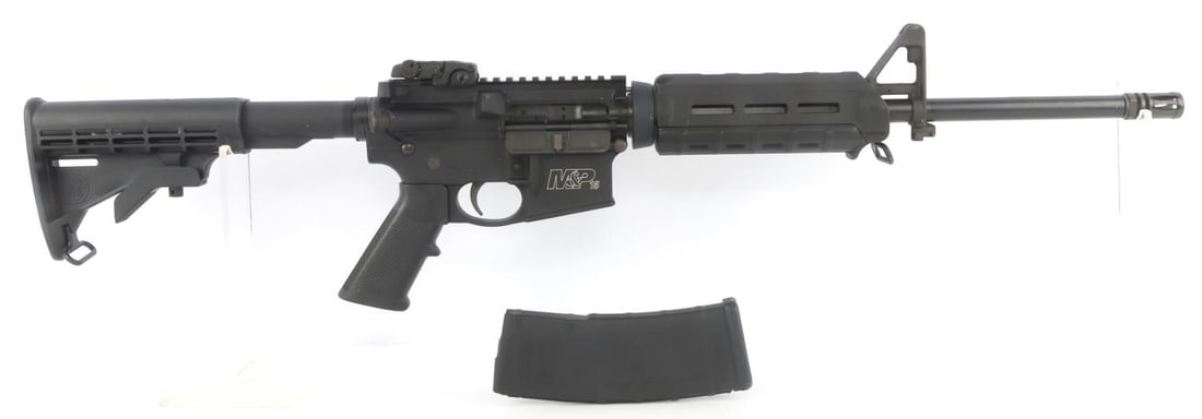 S&W M&P15 SPORT II SEMI AUTO RIFLE CAL 5.56: Used S&W M&P15 semi-automatic rifle. Includes one (1) magazine. Features Magpul MBUS rear peep sight, Magpul handguard and 6-position collapsible stock. Very good condition. Bore is bright and clear.