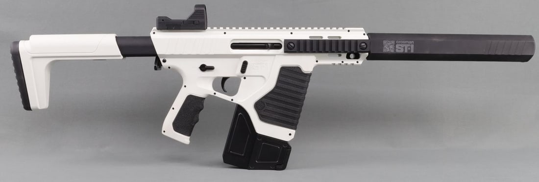 CROSMAN ST-1 CO2 FULLY AUTOMATIC BB AIR RIFLE: Crosman, ST-1, 4.5mm BB CO2, powered fully automatic BB air rifle. Model #CFAST1. Includes one (1), 300-round BB magazine, a barrel extender, a red dot sight, and an adjustable/removable stock. Dual C