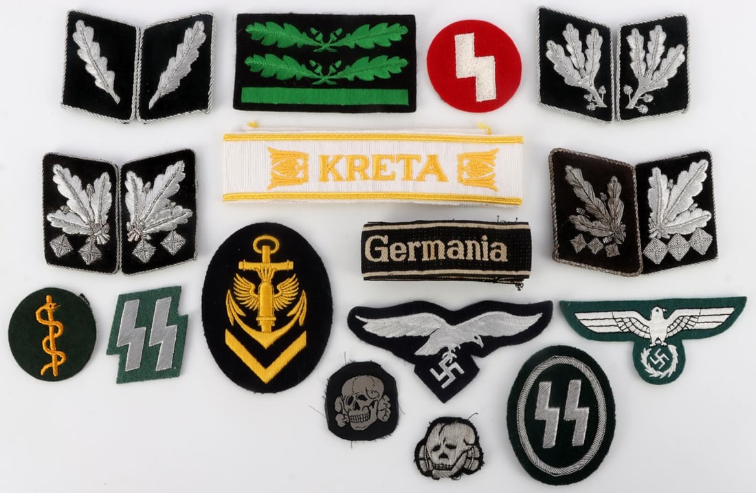 WWII GERMAN THIRD REICH PATCHES AND BADGES LOT: Lot of WWII German Third Reich Patches and Badges. Eight (8) Oberstgruppenfuhrer collar tabs (2 1/2 inches). Ten (10) assorted patches, SS, Wehrmacht eagle, Skull and bones, Kreigsmarine, Heer Camo. R