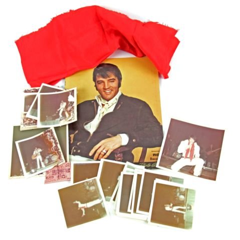 COLLECTION OF ELVIS MEMORABILIA W CONCERT SCARF: Elvis Presley's scarf and memorabilia from September 12, 1970 Florida concert. Scarf ripped in half. Measures 34 by 12 inches. Collection includes photographs of Elvis wearing scarf, a RCA Records pho