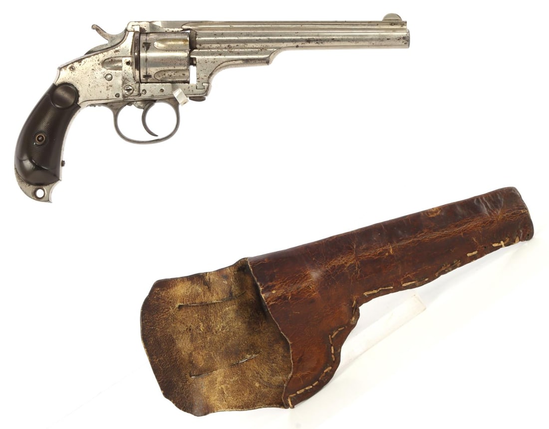 MERWIN HULBERT POCKET MODEL REVOLVER BIRDS HEAD 38: Merwin & Hulbert 4th Pocket Model double-action revolver with handmade leather holster. Closed top, 5.5-inch barrel, with five-shot fluted cylinder and sliding loading gate. Birds head hard rubber gri