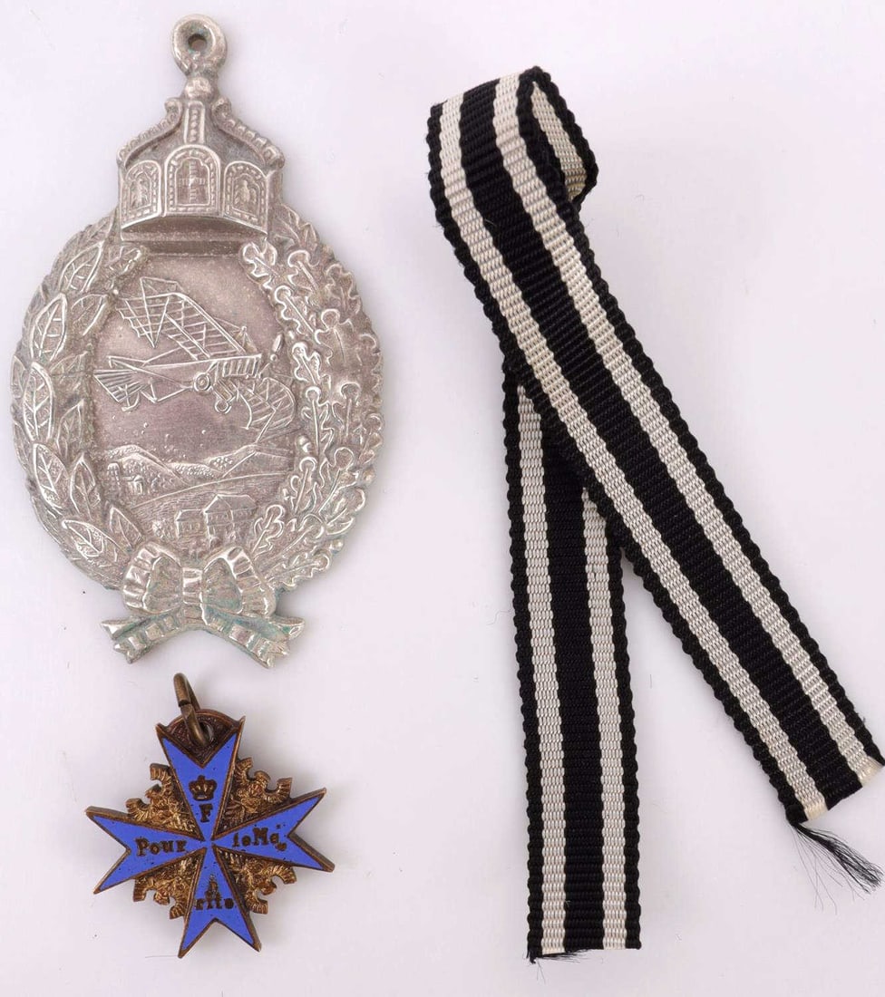 WWI MINIATURE POUR LE MERITE AND PILOT BADGE: Imperial German. Pilot badge is marked by Juncker. They measure7/8 inches, Pilot badge measures 2 inches. This lot has a reserve.