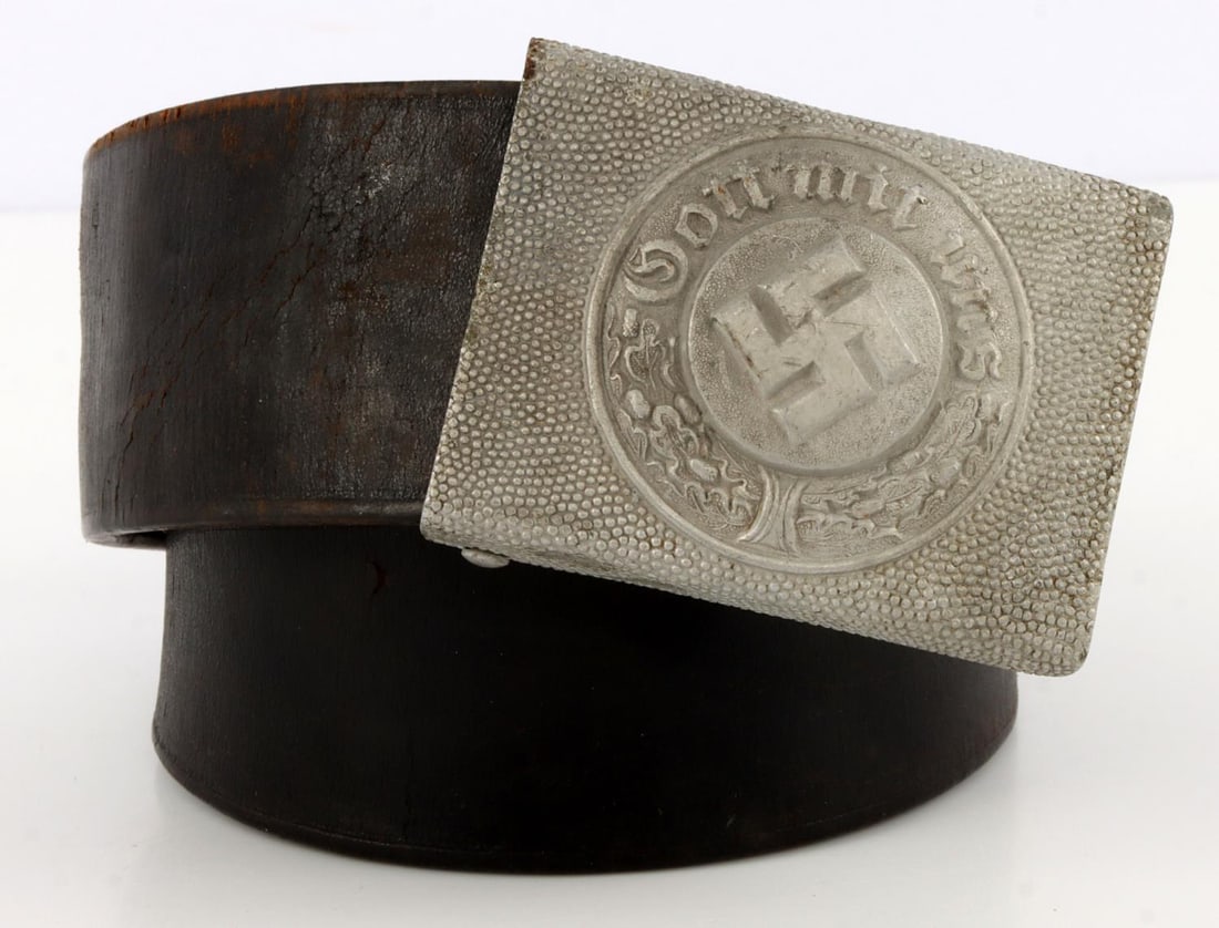 WWII GERMAN THIRD REICH SS BELT & BUCKLE RZM 1943: WWII German Third Reich SS Belt & Buckle stamped with maker "RZM 155/43." Magnetic buckle. Belt leather construction. Buckle 2 1/2 to 1 7/8 inches. Belt measures 32 1/2 inches L. This lot has a reserv