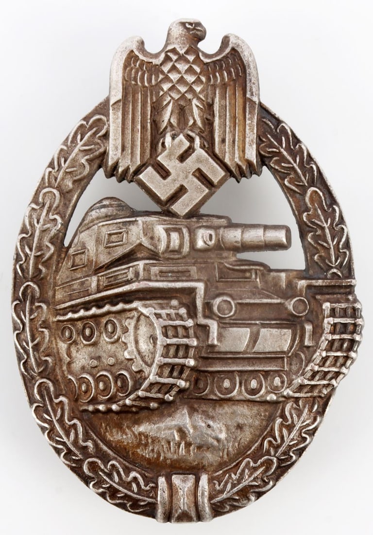 WWII GERMAN THIRD REICH PANZER ASSAULT BADGE ORTH: Wreath and Reichsadler surrounding a panzer. Straight pinback. Friedrich Orth maker mark. 1.75 X 2.5 inches. Very good, original condition. This lot has a reserve.