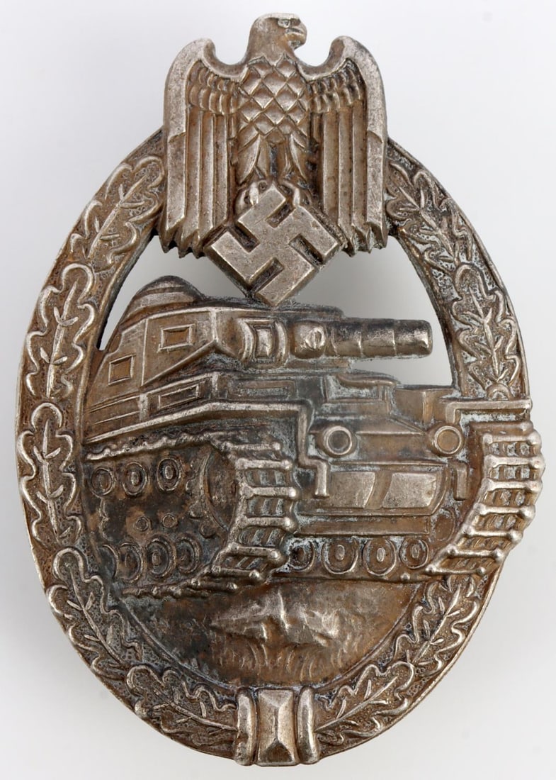 WWII GERMAN THIRD REICH PANZER ASSAULT BADGE EWE: Wreath and Reichsadler surrounding a panzer. Straight pinback. Friedrich Orth maker mark. 1.75 X 2.5 inches. Very good, original condition. This lot has a reserve.