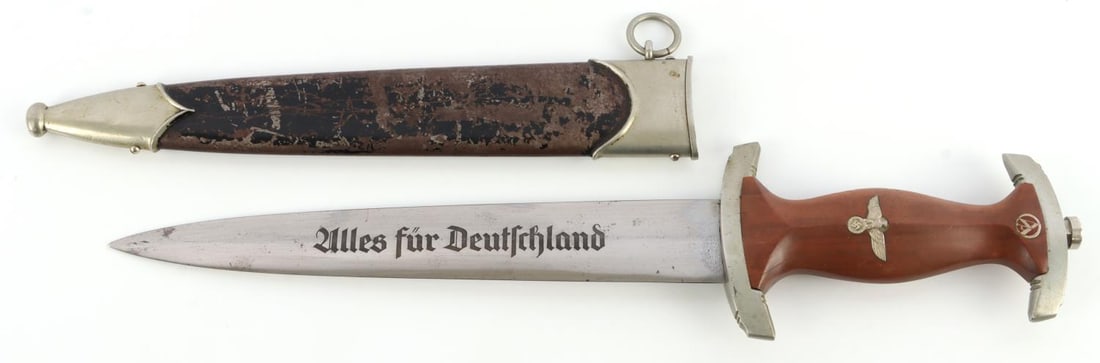 WWII GERMAN REICH NSKK SA ERNST ROHM DAGGER: SA dagger with steel blade, nickel crossguards, and wood grip. Inlaid eagle and SA runes. Acid etched motto and Rohm inscription. Eickhorn make. Group code: "oN" on crossguard. P and A engraved on int