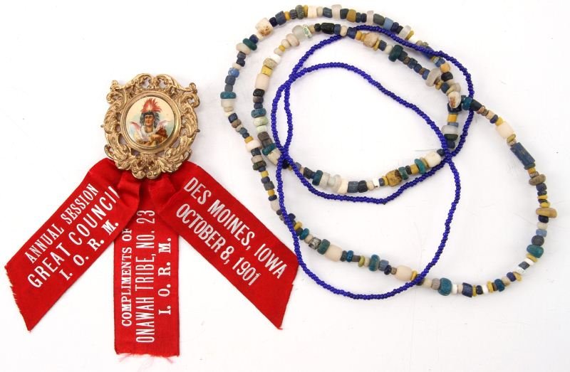 INDIAN IORM AND TRADE BEADS: Ribbon for the Improved Order of Red Men "Des Moines October 8, 1901. Complements of Onawah Tribe No. 23". Reverse marked Whitehead & Hoad Co. Newark NJ Pat. Appld for" In excellent condition. Glass t