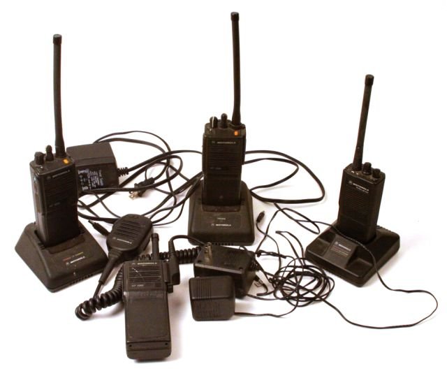 3 MOTOROLA HT1000 H01SDC9AA3AN, 1 MOTOROLA GP300: Three Motorola HT1000 Handie-Talkie FM Radio H01SDC9AA3AN. One Motorola radius GP300 P93YPC20A1AA. Includes three chargers and One water resistant speaker microphone. In good condition.