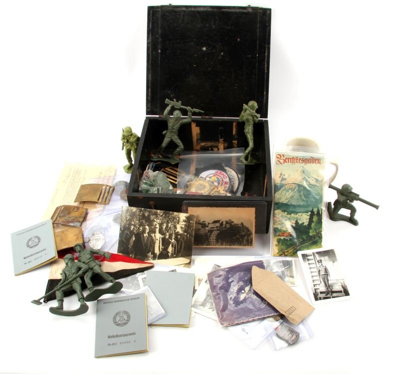 GERMAN MILITARY BOX FULL OF MILITARIA COLLECTIBLES: Box has metal label reading Deutsche Edison Akkumulatoren CO. Berlin, the box is full of items including, antique thermometer, brass belt plates, Tim Mee toy soldiers, Pennsylvania WWI veterans medal,