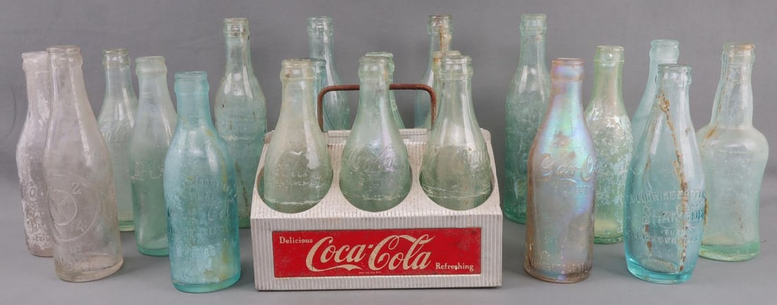 1900S STRAIGHT SIDED SODA BOTTLES COCA COLA PEPSI: Lot of twenty (20) soda bottles, mostly Coca-Cola. A majority are the same model, and all bottles are marked as coming from the Jacksonville bottling plant. Other brands include Pepsi, Dr. Pepper, Mul