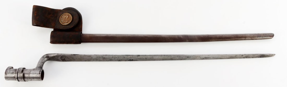 US MODEL 1873 SOCKET BAYONET WITH SCABBARD & FROG: US Model 1873 socket bayonet with scabbard and leather frog. Socket is stamped "H." Frog has "US" brass swivel. Bayonet is 20.75 inches long. Very good condition.