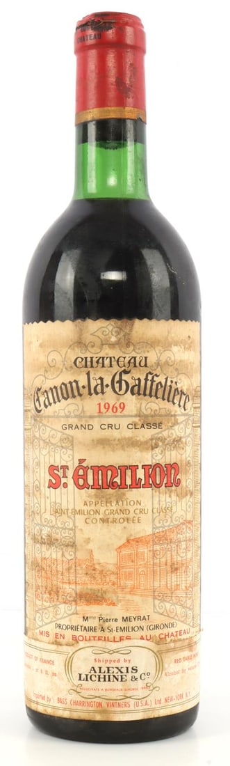 1969 CHATEAU CANON-LA-GAFFELIERE GRAND CRU RED: 1969 Chateau Canon-la-Gaffeliere Grand Cru Classe St. Emilion red wine with ullage at base of neck, sealed cork, and slightly stained label. 750 ml. 13% ABV.