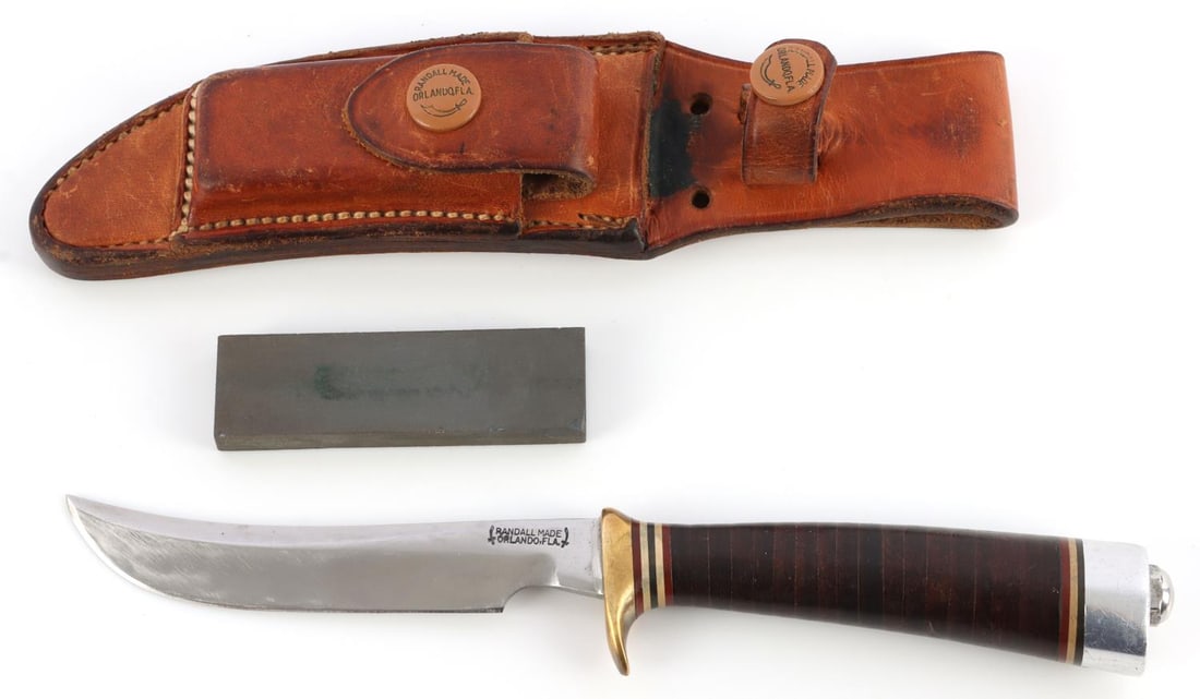 RANDALL KNIFE MODEL 7 4 1/2 BROWN BUTTON SHEATH: Vintage 7 - 4 1/2 with rare brown button rough back sheath. 4.25-inch blade.4.-inch leather grip. Aluminum butt-cap and brass finger guard. This lot has a reserve.