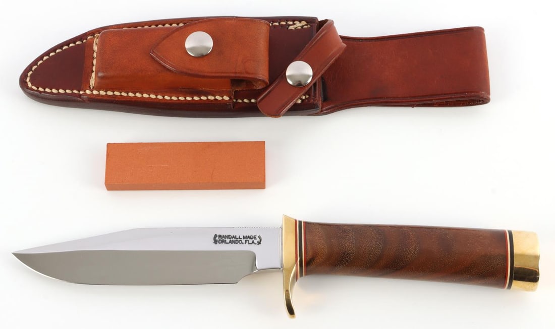 RANDALL MODEL 5 5 KNIFE LEATHER GRIP BRASS GUARD: Includes custom thumb groove and flat top. Blade measures 5 inches. Grip measures 4 3/8 inches. This lot has a reserve.