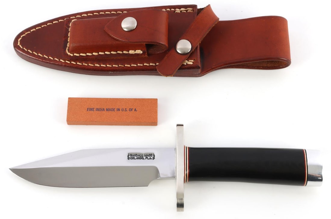 RANDALL MADE KNIVES MODEL 15 MICARTA GRIP: Steel blade, black Micarta grip, nickel finger guard. 5.5-inch blade, 10-inch total length. Leather sheath included, numbered 15. This lot has a reserve.