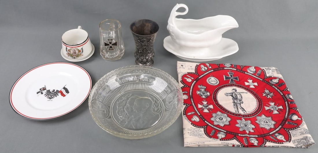 LOT OF 8 WWI IMPERIAL GERMAN PATRIOTIC DINNERWARE: Lot of eight (8) pieces Imperial German patriotic dinner and drink ware items. Includes: Matching cup and saucer set with military portraits of Field Marshal Paul von Hindenburg. Glass mug with 1914 I
