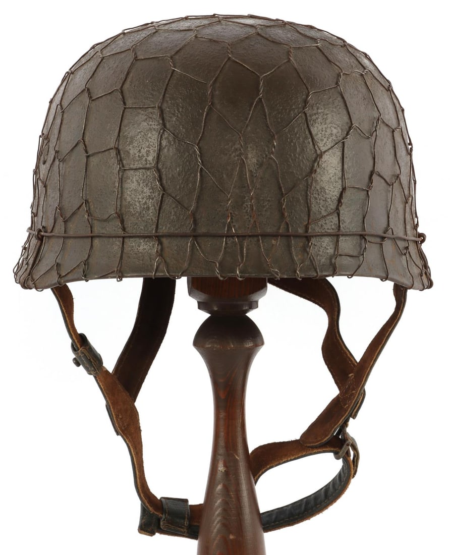 WWII GERMAN THIRD REICH FALLSCHIRMJAGER M38 HELMET: Complete Luftwaffe M38 paratrooper helmet. Textured dark brown paint, chicken wire cover and four (4) vented slotted aluminum bolts. Interior of shell stamped "CKL 71 5416." Leather liner ink stamped 