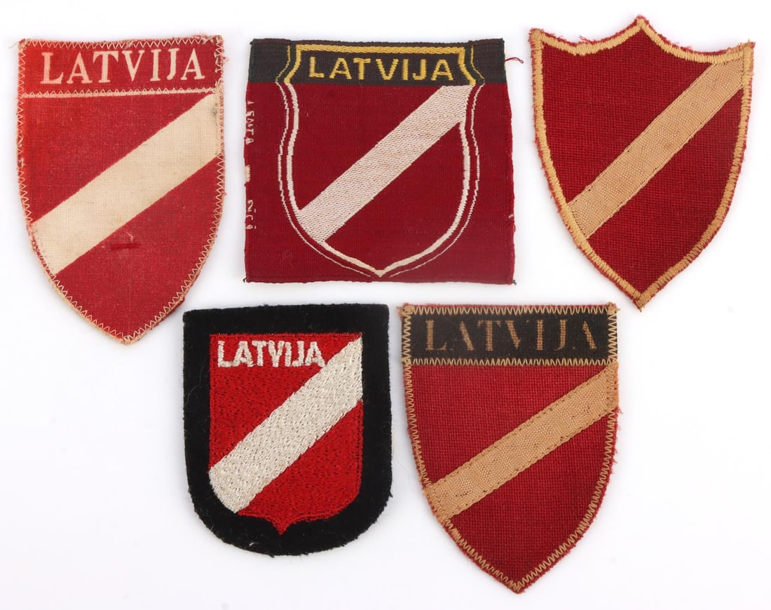 WWII LATVIAN SS LOT OF 5 VOLUNTEER ARM PATCHES: Patches include Latvian Police, Legionnaire, and volunteer patches. Non-fluorescing. They measure 2 3/8 inches approximately. Very good condition. This lot has a reserve.