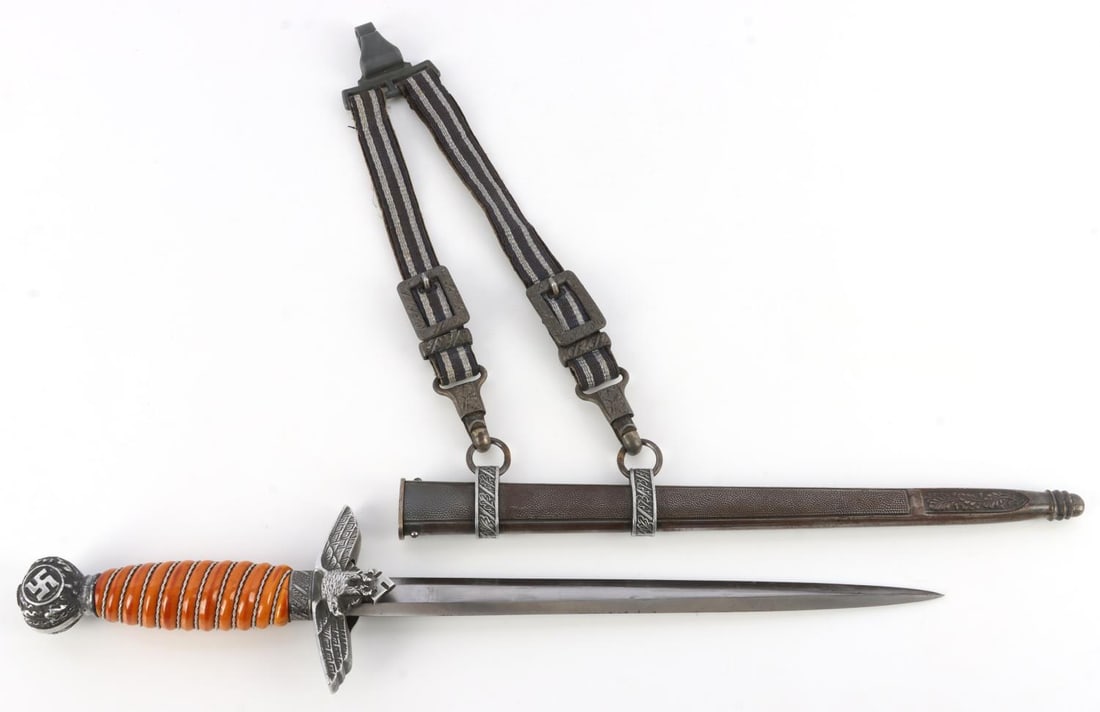 WWII GERMAN THIRD REICH 2ND MODEL LUFTWAFFE DAGGER: Steel blade with Herder maker mark on reverse. Grip is Bakelite. Aluminum crossguard and pommel. Good tang. Housed in pebbled scabbard with hangers. Large hanger clasp has been possibly replaced. 15.2