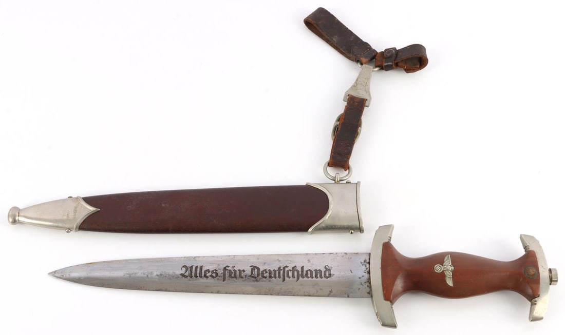 WWII GERMAN REICH SA DAGGER ALBERT DORSCHEL MAKE: SA dagger with steel blade, nickel crossguards, and wood grip. Inlaid eagle and SA runes. Acid etched motto. Wm city mark on crossguard. 14.75 inches. This lot has a reserve.
