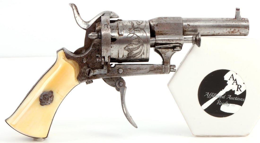 ENGRAVED 5MM PETITE PINFIRE REVOLVER W IVORY GRIP: Factory engraved Lefaucheux-type miniature pinfire revolver, Liege, Belgium. Double action with 2-inch rifled barrel, two-piece ivory grip, folding trigger, and six-round capacity. Cylinder has "ELG" 