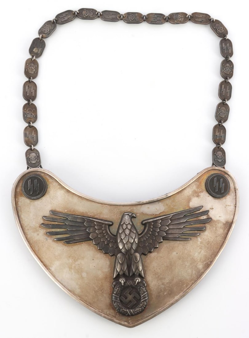 WWII GERMAN THIRD REICH SS STANDARD BEARER GORGET: German SS standard bearer gorget .Reichsadler flanked by SS insignia. Model II gorget. Silver plated. RZM 1/128 stamp on back. Chain is alternating totenkopfs and SS sig-runes. 7.75 X 4 inches on gorg