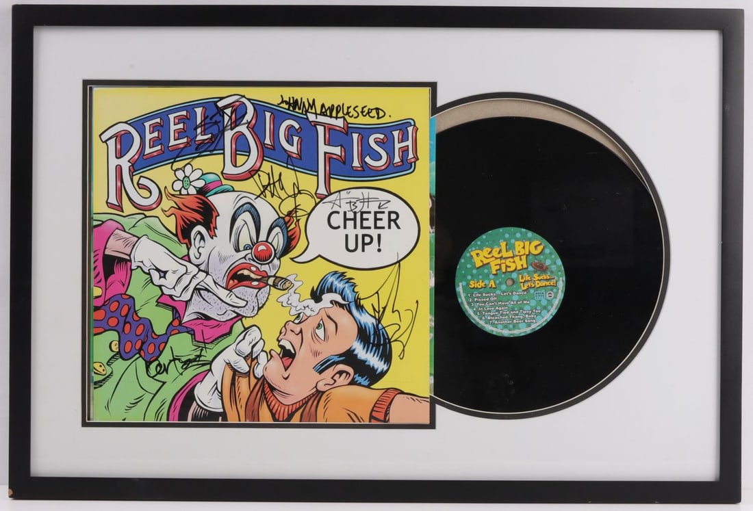 CHEER UP ALBUM SIGNED BY BAND REEL BIG FISH: A framed copy of the album 'Cheer Up' signed by the band Reel Big Fish. Signatures deemed authentic according to terms. Approx. 26 X 17 inches (framed). Very good, original condition.