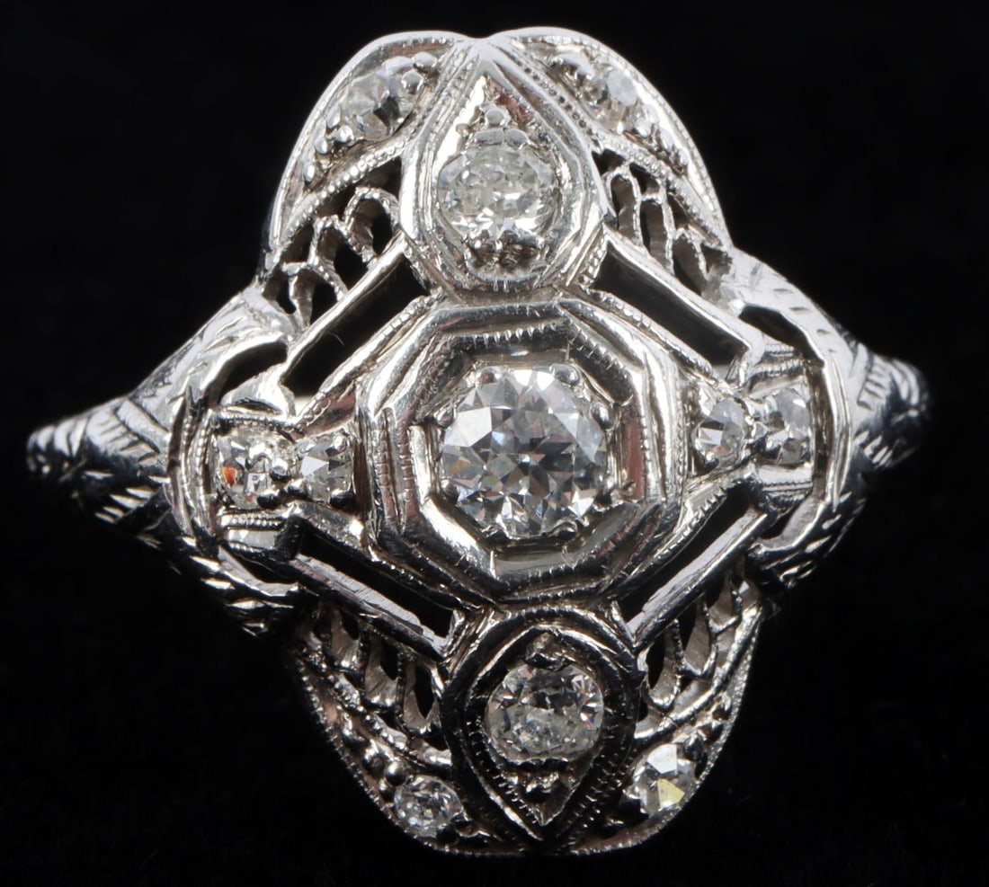 PLATINUM IRIDIUM DIAMOND SHEILD RING SIZE 9: Stamped "PLAT IRID" on inside of shank. Center diamond measure 3.83 millimeters. Flanking diamonds measure 2.5 millimeters and 1.8 millimeters. Total weight: 4.99 grams. This lot has a reserve.